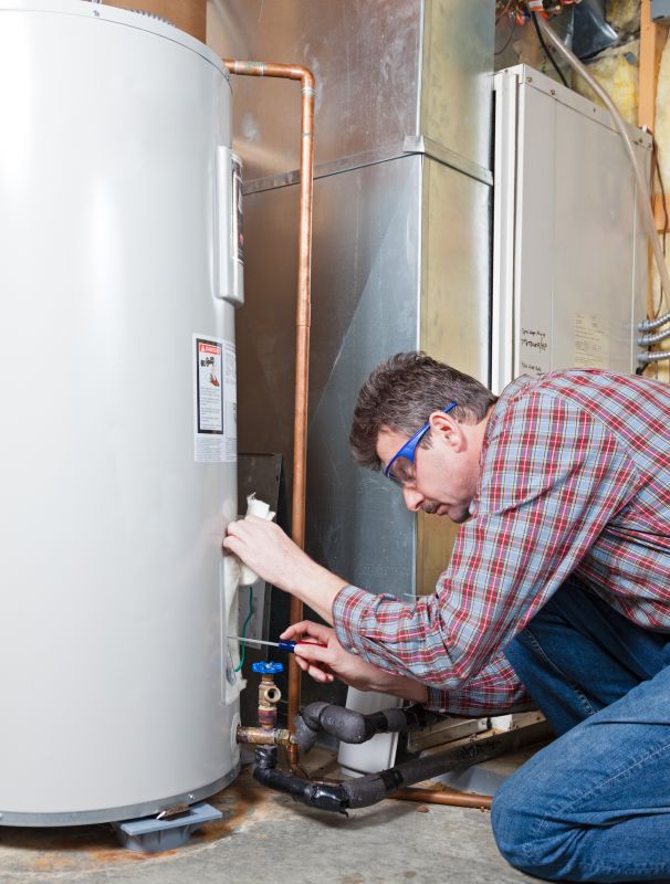 Technician Repairing Water Heater